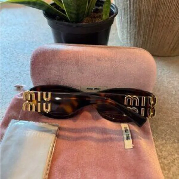 Miu Miu Black Sunglasses with Pink Velvet Case is available  display picture 1